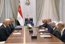 Egypt, Eni Discuss USD 8.5 Billion Energy Investment Plans Formal meeting with government officials seated around a long conference table; the Egyptian flag and national emblem are visible behind the central chair.